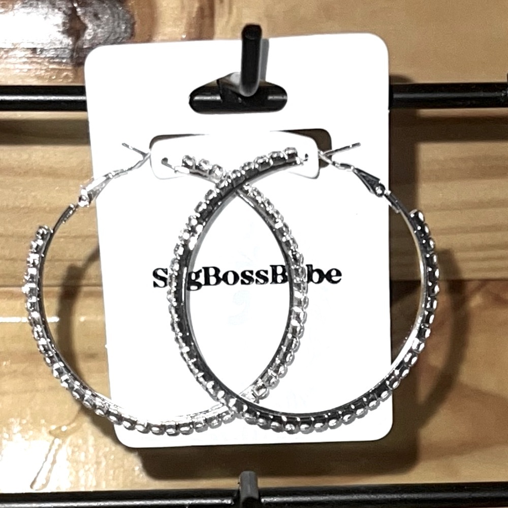 Rhinestone silver hoops a little bit smaller. One pair of these left.
